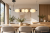 Lampa wisząca BALOS Italux PND-94921-4A-BK ma czarną oprawę, białe szkło opalowe i ceramiczne detale. Zintegrowane LED 23W oraz pozioma forma sprawdzą się nad stołem w jadalni.