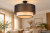 Nowoczesna lampa sufitowa WOOD BOHO 1xE27 czarna z jasnym fornirem jesion. Metal, organza i naturalne drewno tworzą ciepły klimat wnętrza. Średnica 45 cm, IP20, 230V. Idealna do przytulnych, naturalnych aranżacji.
