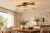 Lampa ESTERA WOOD 3 × G9 łączy brązową konstrukcję, drewno w kolorze orzecha i bursztynowe szkło. Można zamontować ją na suficie lub ścianie. Wymiary: 47 × 23 × 17 cm. Żarówki są sprzedawane osobno.