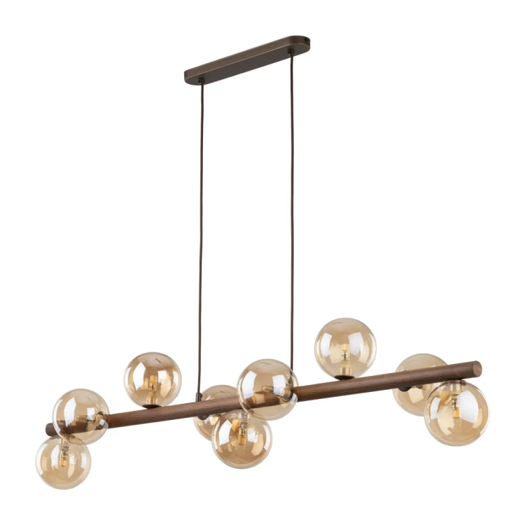 Lampa wisząca ESTERA WOOD TK-Lighting 11097 ma 9 bursztynowych szklanych kloszy i drewnianą belkę w kolorze orzecha. Dzięki długości 117 cm sprawdzi się nad dużym stołem w jadalni.