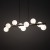 Lampa wisząca ESTERA WOOD 9 × G9 rozświetli stół w jadalni lub wyspę kuchenną. Białe szklane klosze kontrastują ze stelażem w kolorze orzecha. Model 10273 ma 117 cm długości, stopień ochrony IP20 i nie zawiera żarówek.