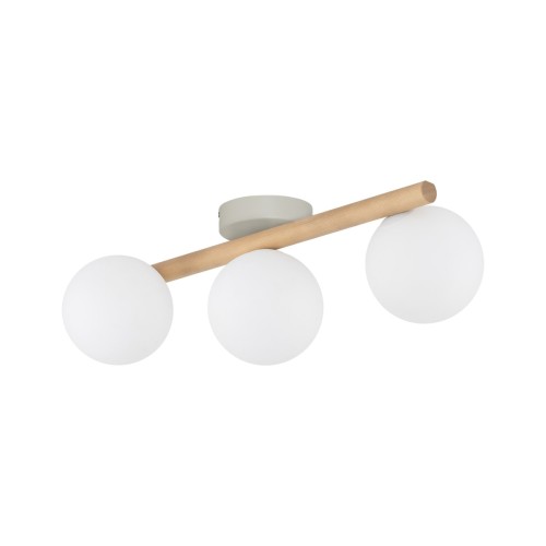 Lampa sufitowa ESTERA WOOD TK-Lighting 5768 łączy jasne drewno sosnowe z trzema białymi szklanymi kulami. Ma 47 cm szerokości i trzy oprawki G9. Pasuje do salonu, sypialni i przedpokoju.