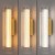 TRIVIA GOLD Milagro ML2723 łączy złoty metal z ryflowanym akrylem. Klosz 30 cm, Ø6 cm, LED 6 W i CCT 2700/3000/4000 K. Stopień ochrony IP44. Do aranżacji przy lustrze lub łóżku. Bez ściemniania i czujnika ruchu.