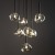 LAVA 11328 TK-Lighting to lampa wisząca w stylu glamour. Brązowy stelaż i 7 szklanych kloszy w kolorze koniaku sprawdzą się nad okrągłym stołem. Wysokość 150 cm, szerokość 48,5 cm, 7xG9 LED max 8 W każde. naszelampy24.pl. AI