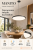 Czarna lampa MANITO Italux łączy minimalistyczny wygląd z oświetleniem LED 32W. Zmiana barwy światła CCT pozwala dopasować je do wnętrza. Średnica 40 cm, wysokość całkowita 120 cm. Do jadalni, kuchni i salonu.
