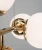Lampa wisząca PACO 6×E14 Elem 3401/6A TR łączy złotą armaturę z białymi kulami. Pasuje do wnętrz glamour i modern classic. Szerokość 70 cm, głębokość 30 cm, wysokość 40–98 cm. Metal i szkło, waga 1,8 kg.