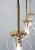 Lampa wisząca LEO 3×E14 Elem 7465/3 TR łączy złote detale, czarne przewody i szklane kule. Sprawdzi się nad stołem, barkiem lub wyspą kuchenną. Szerokość 60 cm, wysokość 80 cm, waga 1,6 kg. Do wnętrz nowoczesnych i glamour.