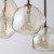 LAVA Brown TK-Lighting to brązowa lampa wisząca nad stół, barek lub wyspę kuchenną. Ma 8 nieregularnych kloszy ze szkła koniakowego. Wymiary 87 × 33 × 120 cm. Żarówki G9 do kupienia osobno. Stopień ochrony IP20.