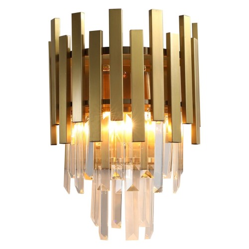 Milagro ASPEN ML5998 to stylowy kinkiet wykonany z metalu i kryształów. Złote wykończenie oraz efektowne refleksy światła sprawiają, że lampa doskonale prezentuje się w eleganckich wnętrzach glamour i modern classic.