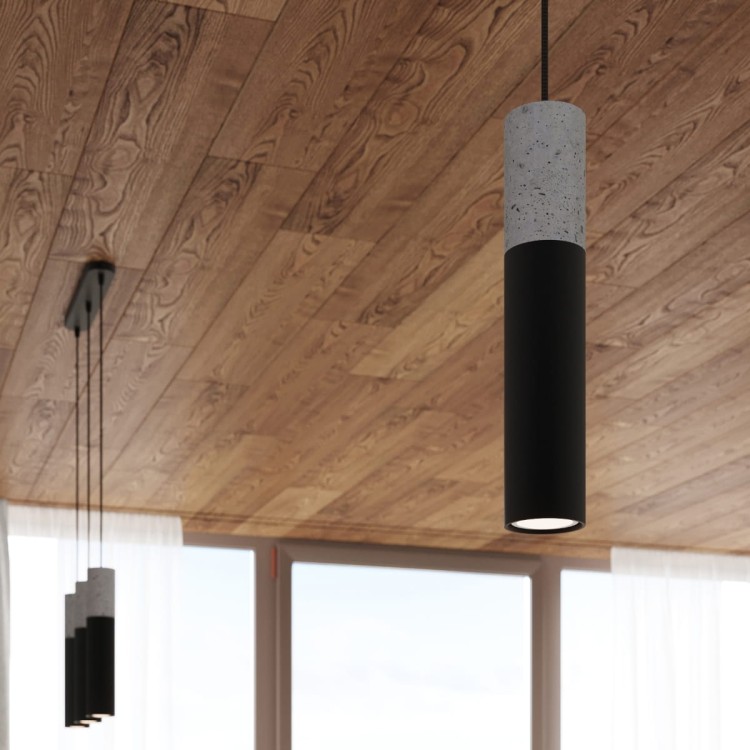 Betonowa lampa wisząca BORGIO tuba to nowoczesne oświetlenie w loftowym stylu. Połączenie szarości betonu i czerni stali podkreśla industrialny charakter wnętrza. Lampa 3xGU10 z regulacją zawiesia, idealna nad stół do jadalni, salonu, kuchni czy sypialni