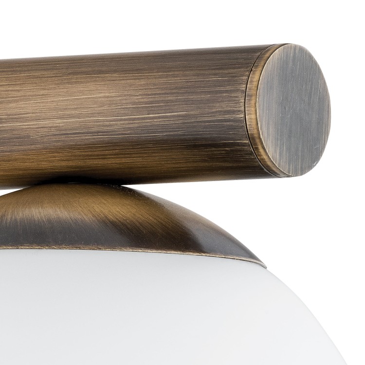 Kinkiet OSSO patyna Lemir O2910 K1 PAT – elegancka lampa ścienna z białym, matowym kloszem w formie kuli. Idealny do sypialni, salonu i korytarza. Polska produkcja Lemir – jakość i tradycja od 1967 roku.