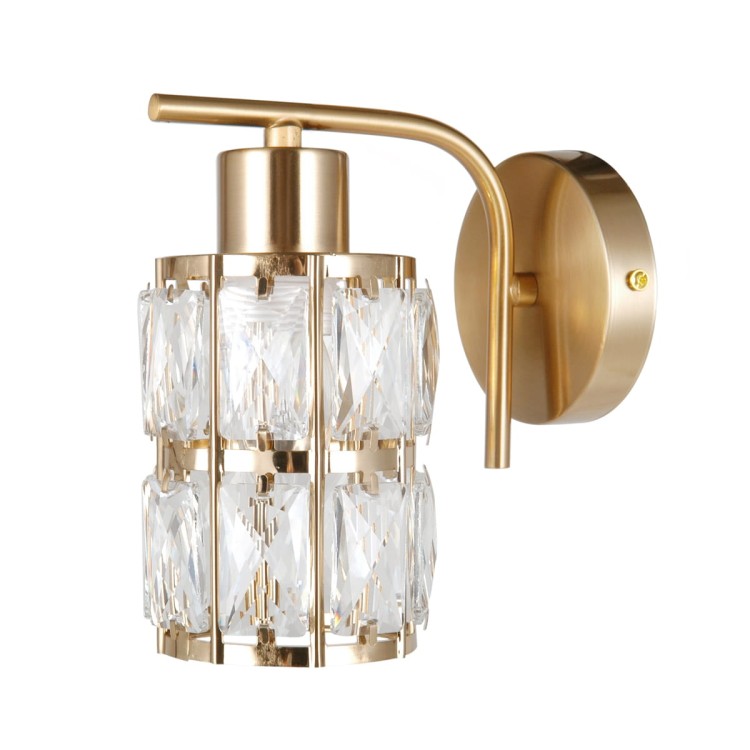 Kinkiet ALMA złoty Italux z kryształkami to elegancka lampa ścienna w stylu glamour. Transparentny klosz pięknie rozprasza światło, tworząc przytulny klimat w salonie, sypialni lub korytarzu. Oprawa na żarówkę E27.