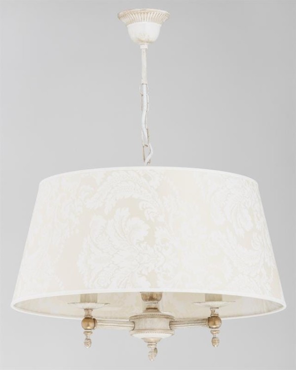 ROKSANA 18534 to elegancki żyrandol 3-płomienny marki Alfa, stworzony z myślą o wnętrzach w stylu prowansalskim i rustykalnym. Połączenie białego antycznego stelaża ze szarymi, tekstylnymi abażurami nadaje lampie lekkości, subtelności i wyjątkowego uroku.