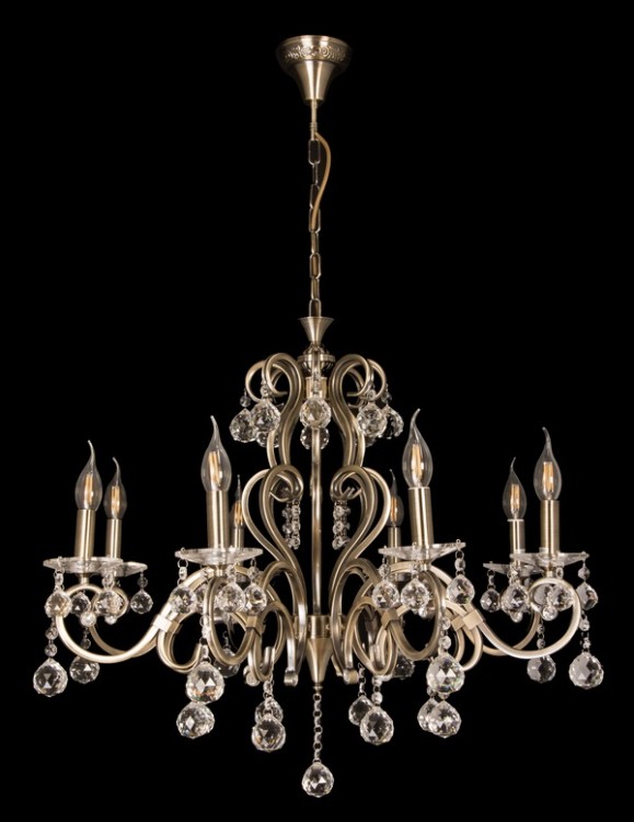 Żyrandol FLORENCE 8xE14 w stylu glamour to elegancka lampa do salonu z dekoracyjnymi abażurami ecru i kryształkami w formie kulek. Wykończenie w kolorze patyny podkreśla klasyczny charakter. Średnica 66 cm, wysokość 98 cm z możliwością skrócenia