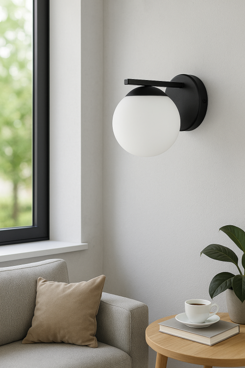 Kinkiet CARMEN O3640 K1 CZA to elegancka lampa ścienna polskiej produkcji. Czarna matowa oprawa i biały klosz kula ze szkła opalowego pasują do nowoczesnych wnętrz. Wykonanie: metal i szkło. Źródło światła 1xE27, max 60W. Wysoka jakość i styl.