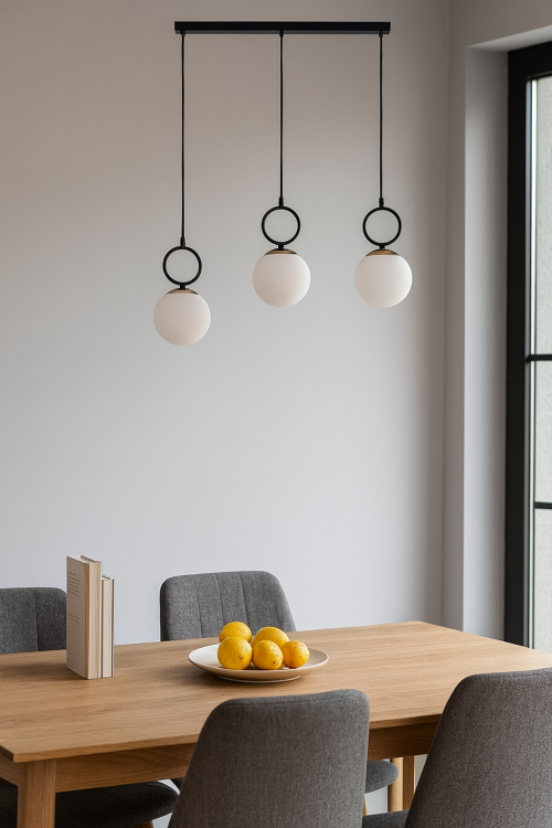 Lampa sufitowa LISTER w kolorze czarnym ze zlotymi dodatkami. Klosze białe w formie kuli. Nad kloszami umieszczone elementy ozdobne. Klosze na linkach przytwierdzone do listwy.