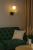 Kinkiet TORDI WL-94721-1A-GRN marki Italux łączy nowoczesny design z elegancją. Czarna armatura, biały klosz i zielona ceramika tworzą unikalny efekt. LED 8W 903lm o barwie 3000K daje ciepłe światło. Idealny do salonu, sypialni i przedpokoju