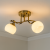 Lampa sufitowa ODETA Venti W-N2465/2 AB w kolorze patyny z dwoma białymi kloszami. Styl klasyczny, wykonanie metal i szkło. Wymiary: szerokość 42 cm, wysokość 23 cm. Źródło światła 2x E27 60W (brak w zestawie, możliwość LED