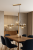 Lampa sufitowa CANELLO Italux 7xG9 w kolorze mosiądzu miodowego z bursztynowymi kloszami. Stylowa oprawa wykonana z metalu i szkła, idealna do salonu, jadalni i kuchni. Regulowana wysokość do 150 cm, gwarancja 2 lata
