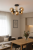 Designerski plafon BOSS 5xE14 Alfa – lampa sufitowa w kolorze czarnym i złotym z bursztynowymi kulistymi kloszami. Solidna konstrukcja z metalu i szkła, średnica 65 cm, wysokość 33 cm. Lampa na pięć żarówek E14 do 10W.