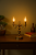 Lampa stołowa ANTARES 2x60W patyna Lemir O1318/L2 to eleganckie oświetlenie w stylu klasycznym. Wykonana z metalu i odlewu ZNAL, zachwyca patynowanym wykończeniem i stylowym kształtem. Idealna do salonu, sypialni lub gabinetu.