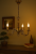Żyrandol klasyczny ANTARES 3x60W patyna Lemir O1313/W3 to elegancka lampa świecznikowa wykonana ze stali i odlewu ZNAL. Patynowane wykończenie i brązowe kryształki dodają wnętrzu ciepła i stylu. Idealny do salonu, jadalni lub sypialni.