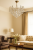 Żyrandol kryształowy RODOS złoty 6x60W Venti to elegancka lampa sufitowa z przezroczystymi kryształami. Średnica 55 cm, wysokość 60 cm. Idealna do salonu i jadalni. Złota oprawa i 6 źródeł światła tworzą luksusowy efekt.