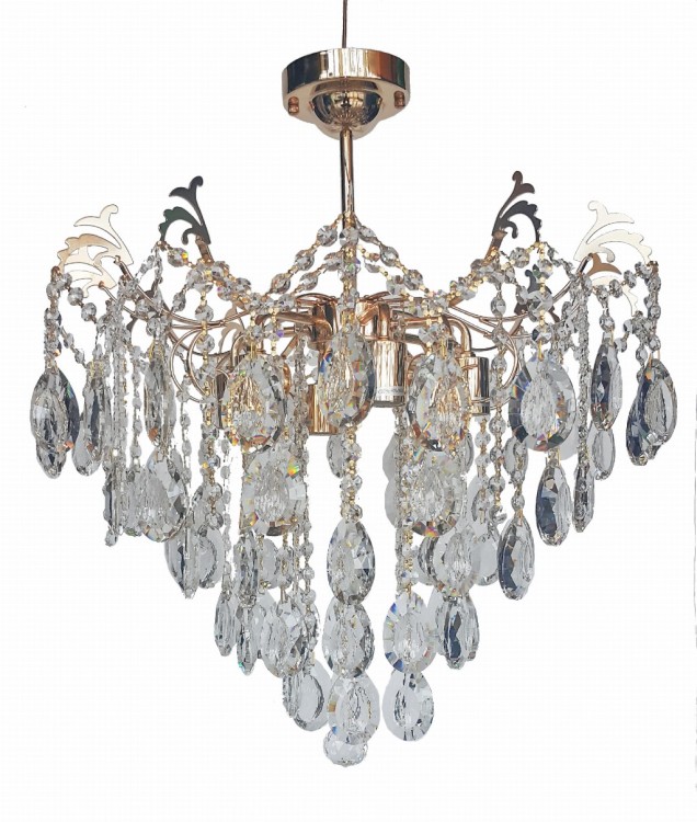 Lampa RODOS Venti to złoty żyrandol kryształowy o średnicy 55 cm i wysokości 60 cm. 6 źródeł E27 daje mocne i efektowne światło. Idealny wybór do wnętrz glamour i klasycznych