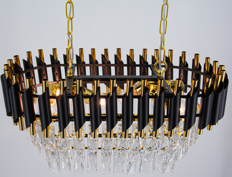 Lampa wisząca TOLEDO 6xE27 czarna złota z kryształami to idealne oświetlenie nad stół. Styl glamour, eleganckie wykończenie i efektowne odbicia światła tworzą wyjątkową atmosferę w jadalni i salonie.