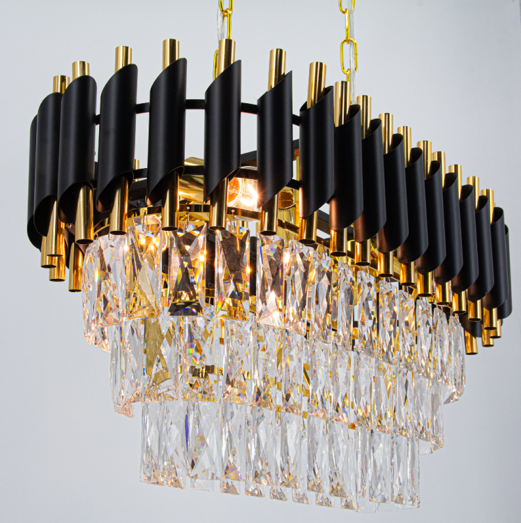 Kryształowy żyrandol TOLEDO 6xE27 czarny złoty to elegancka lampa nad stół do jadalni. Połączenie metalu i kryształów daje wyjątkowy efekt świetlny. Idealny wybór do wnętrz glamour i nowoczesnych.