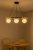 Lampa wisząca MIRROR 3xG9 Sigma to połączenie czarnej stali, brązowego drewna i białych kul. Idealna nad stół lub wyspę. Nowoczesny design, naturalne akcenty i trzy źródła światła tworzą przytulne i efektowne oświetlenie do jadalni i salonu.
