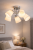 Lampa sufitowa Pafos 5xE27 to eleganckie oświetlenie do salonu i jadalni. Chromowana konstrukcja i mleczne klosze zapewniają równomierne, przyjemne światło i ponadczasowy styl.