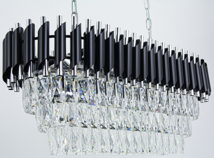 Designerski żyrandol TOLEDO 8xE27 czarny chrom to połączenie metalu i kryształów. Elegancka forma i osiem źródeł światła tworzą piękne refleksy, nadając wnętrzu prestiżowy wygląd.