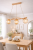 SANA Alfa 62495 to elegancka lampa sufitowa 3xE14 z naturalnego drewna i kloszy amber. Zapewnia ciepłe, nastrojowe światło i doskonale sprawdza się nad wyspą kuchenną lub stołem w stylu skandynawskim i boho.