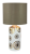 Lampka stołowa GINGER Rabalux 6030 to eleganckie oświetlenie z ceramiczną podstawą i tkaninowym abażurem. Połączenie bieli, brązu i złota tworzy stylowy efekt. Idealna do sypialni lub salonu.