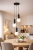 Nowoczesna lampa sufitowa ALDEVA 3xE27 Italux z czarną konstrukcją i białymi kloszami w formie kul doskonale oświetli stół lub salon. Regulowana wysokość do 127 cm pozwala dopasować lampę do różnych aranżacji wnętrz.