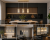 Złota lampa sufitowa MERTO 3xE14 Italux z transparentnymi kloszami ze szkła. Nowoczesne oświetlenie wiszące nad stół lub blat, idealne do wnętrz w stylu glamour, modern i minimalistycznym.