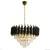 Lampa Cristal 7xE14 to elegancki żyrandol glamour o średnicy 48 cm i wysokości 90 cm. Połączenie czerni, złota i kryształów tworzy luksusowy efekt, idealny do salonu, jadalni lub sypialni. Stylowe oświetlenie, które odmieni każde wnętrze.