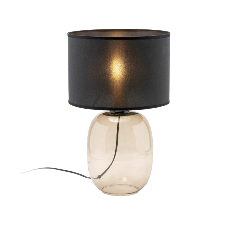 Nowoczesna lampka stołowa TK Lighting MELODY 5988 to połączenie stylu glamour z funkcjonalnością. Czarny abażur subtelnie rozprasza światło, a szklana podstawa nadaje wnętrzu elegancji i przytulnego charakteru.