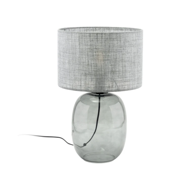 Lampka stołowa MELODY 5987 TK Lighting zachwyca połączeniem grafitowej szklanej podstawy i eleganckiego szarego abażura. Idealna do salonu, sypialni oraz gabinetu. Tworzy przytulny klimat i podkreśla nowoczesny charakter wnętrza.