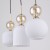 Lampa wisząca SOPHIA Cognac została stworzona z myślą o stylowych wnętrzach. Białe ryflowane klosze pięknie rozpraszają światło, a dekoracyjne kule cognac nadają całości luksusowego i ponadczasowego wyglądu