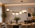 Żyrandol OSSO 7xE14 patyna Lemir O2917 W7 PAT to elegancka lampa nad stół do jadalni. Siedem białych matowych kul, wykończenie w kolorze patyny oraz podział świecenia 3+4 tworzą efektowne i funkcjonalne oświetlenie nowoczesnych wnętrz