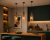 Designerska lampa wisząca BUSCO 1xE27 Italux z bursztynowym kloszem i złotą oprawą. Idealna nad stół, wyspę kuchenną czy do salonu. Wykonana z metalu i szkła, regulowana wysokość, elegancki akcent w każdym wnętrzu