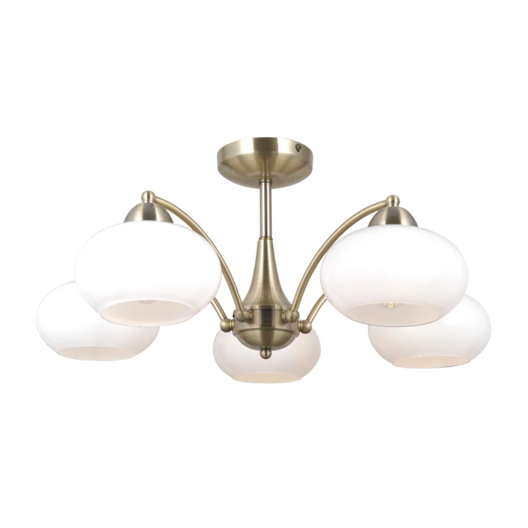 Lampa sufitowa FOLTE 5xE27 Italux łączy oprawę w kolorze złotej patyny z pięcioma białymi kloszami. Szerokość 60 cm i wysokość 27 cm sprawiają, że doskonale pasuje do salonu, jadalni lub sypialni.