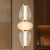 Lampa sufitowa GASTEL Italux ma trzy dekoracyjne klosze ustawione pionowo. Zintegrowane źródło LED zapewnia 1000 lm i ciepłą barwę 3000K. Smukła oprawa sprawdzi się nad barkiem, wyspą kuchenną lub stolikiem.