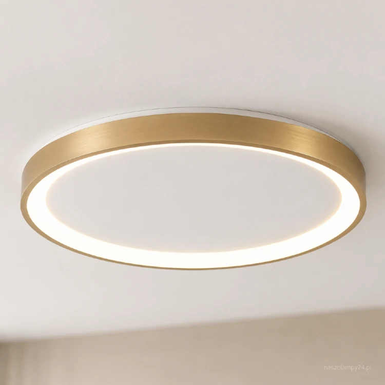 Plafon RADEN złoty 40W LED Italux to eleganckie oświetlenie do nowoczesnych wnętrz. Płaska konstrukcja o średnicy 48 cm dobrze sprawdzi się w salonie, jadalni lub sypialni. Strumień 2400 lm, regulowana barwa 3000–6500K.
