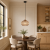 PANSOL Italux PND-2940-1S-BRO-AMB to lampa wisząca z dekoracyjnym kloszem amber. Ryflowane szkło pięknie załamuje światło, a złote i czarne elementy dodają elegancji. Średnica 25 cm, wysokość 107 cm, gwint E27.