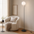 Czarna lampa podłogowa CARIMI z białym kulistym kloszem efektownie dopełni nowoczesne wnętrze. Model Italux FL-3300-1-BK ma 152 cm wysokości, oprawkę E27 oraz praktyczny włącznik umieszczony na przewodzie.