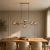 MOLITE PND-1098-6-HB Italux to lampa wisząca z 6 bursztynowymi kloszami i oprawkami E14. Mosiądz miodowy podkreśla elegancki wygląd. Model idealny nad stół w jadalni lub wyspę kuchenną. Teraz 396 zł, wcześniej 706 zł.