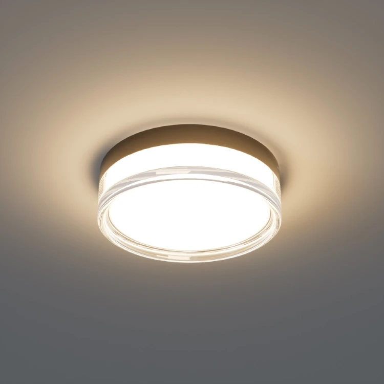 RITA Italux 18W LED to mała lampa sufitowa do łazienki. Średnica 23 cm, funkcja zmiany barwy światła CCT oraz ochrona IP65 tworzą praktyczne rozwiązanie do wnętrz narażonych na wilgoć, takich jak toaleta lub pralnia.